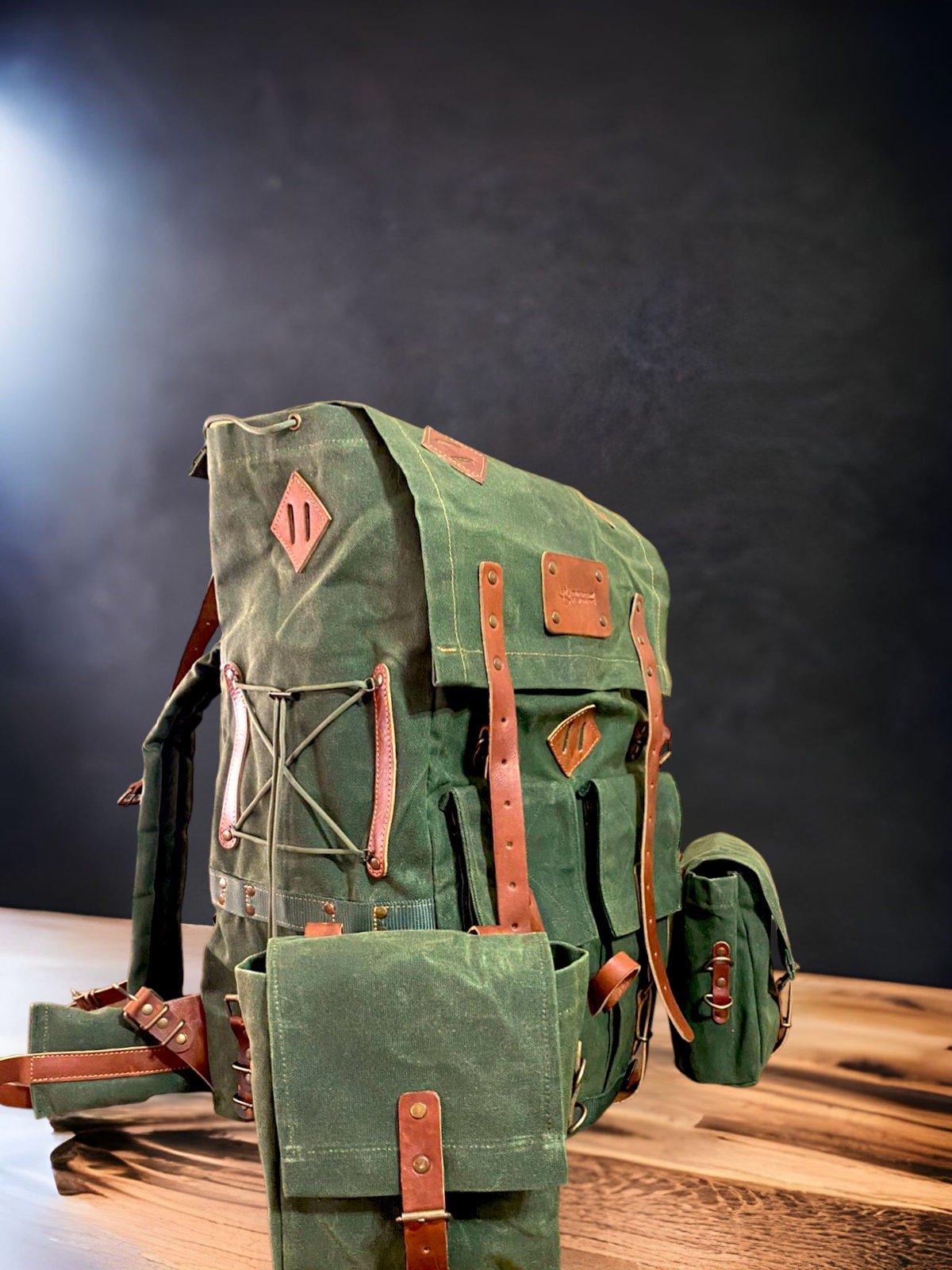 https://www.99percenthandmade.com/cdn/shop/products/handmade-waxed-canvas-leather-backpack-detachable-pouches-50-l-daily-use-bushcraft-travel-camping-hunting-fishing-sports-bag-623260.jpg?v=1678665522